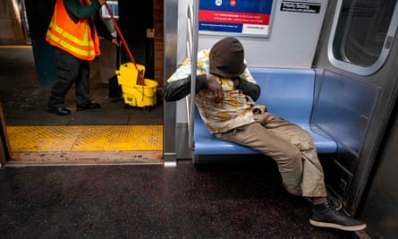 A passenger sleeps inside a subway car at the last stop at the Coney Island station on 6 May.