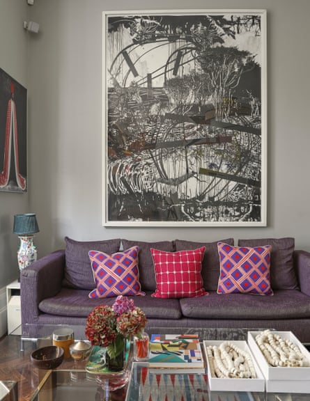 Bright fabrics and West African art in the sitting room.