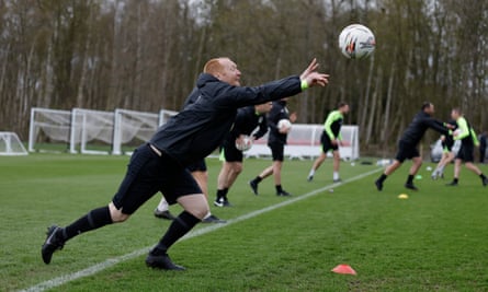 Assistant referee Carl Fitch-Jackson practices throwing a ball during a physical training session.