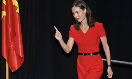 Sanna Marin points her finger as she walks away after her resignation speech