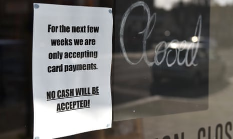 A sign on a door of a shop stating they will no longer be accepting cash and will only be accepting card payments