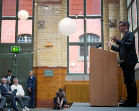Andy Burnham address audience from the podium at the People’s History Museum.