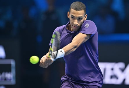 Félix Auger-Aliassime in action against Jannik Sinner at the ATP Finals in Turin in November