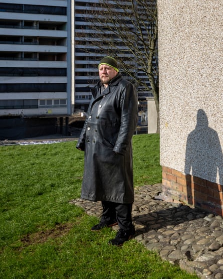 Nick Durie outside the blocks of flats