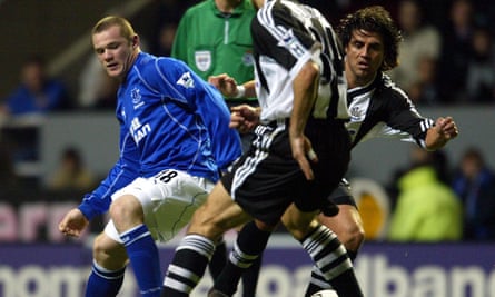 Hugo Viana, right, battles for possession with Wayne Rooney while playing for Newcastle against Everton in November 2002