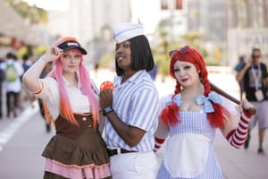 Three people in costume pose