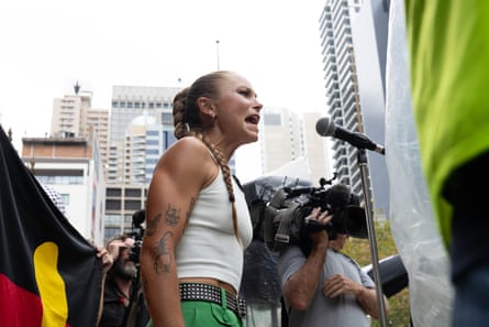 Grace Tame addresses the rally at Town Hall in the Sydney CBD.
