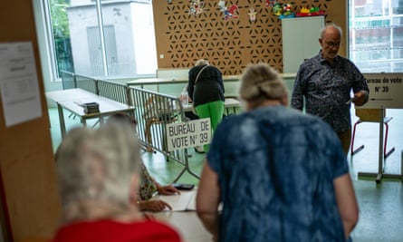 People queue at a polling station