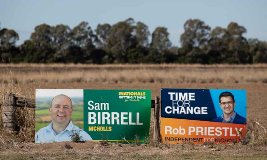Election signs for Nationals candidate Sam Birrell and independent candidate Rob Priestly beside the highway in the federal seat of Nicholls