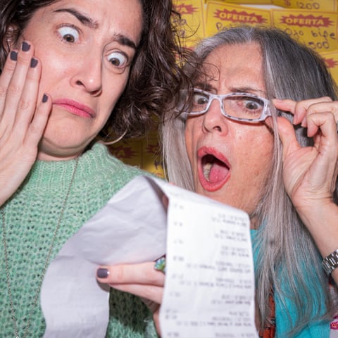 Two of Irina Werning’s friends pose with a shopping receipt