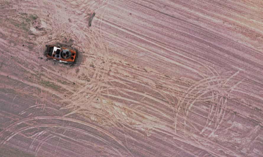 A military vehicle in a grain field previously mined with explosives in the Chernihiv region, Ukraine.