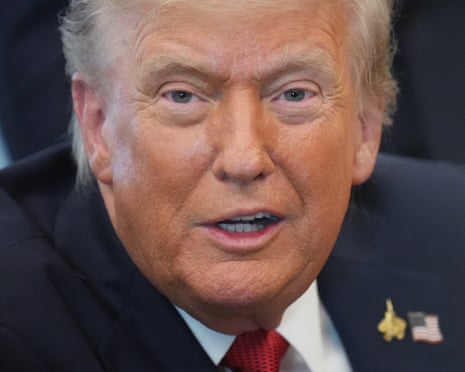 President Donald Trump speaks to reporters during an executive order signing in the Oval Office.