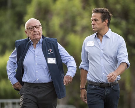 two men walk outside