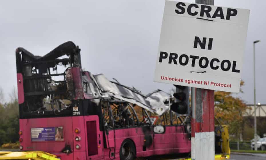A hijacked and burnt-out bus is removed from the loyalist Rathcoole estate in Newtonabbey, Northern Ireland. 