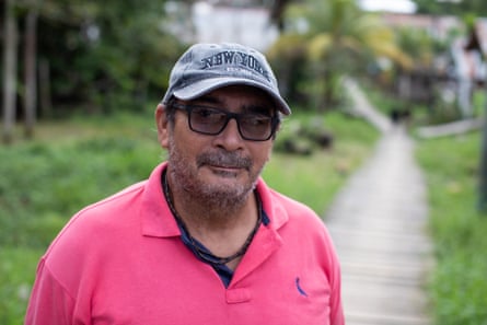 Man in a pink shirt.