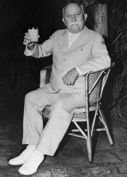 John Harvey Kellogg Sitting and Holding Glass