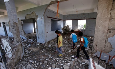 Children walk through their school, damaged by a Saudi-led air strike, in October, in Hodeidah.
