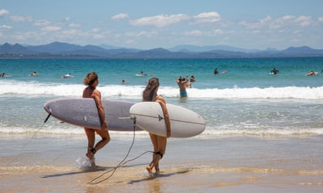 Surfers at Wategos beach in Byron Bay, New South Wales, Australia
