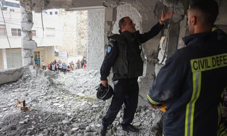 Palestinian police inspect debris