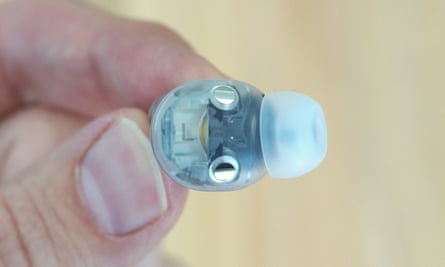 A left Beats Studio Buds+ earbud held between fingers.