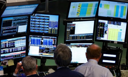 Traders at Bloomberg terminals on the floor of the New York stock exchange, 2013