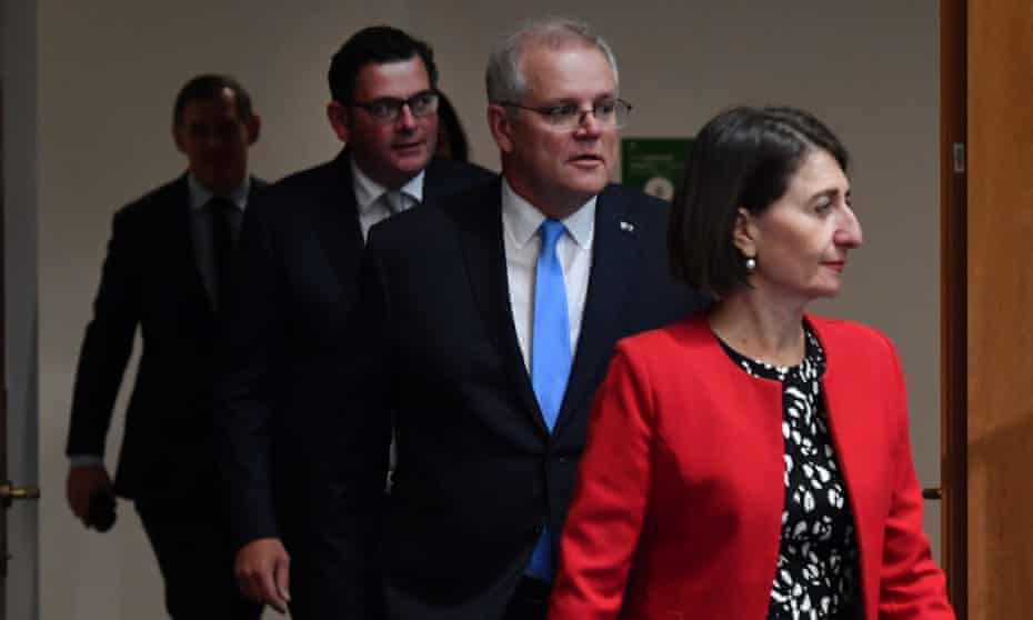 Victoria's premier Daniel Andrews, prime minister Scott Morrison and New South Wales premier Gladys Berejiklian, arrive at a National Cabinet press conference at Parliament House.