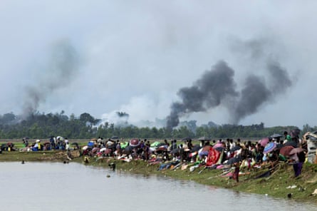 Smoke billows above what is believed to be a burning village in Myanmar’s Rakhine state