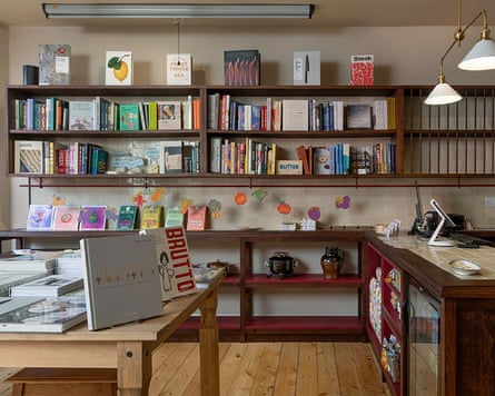 An image of a cookbook shop with books on tables and on shelves.