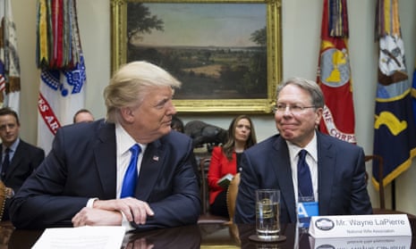 Donald Trump sits beside NRA CEO Wayne LaPierreat the White House on 1 February 2017 in Washington.