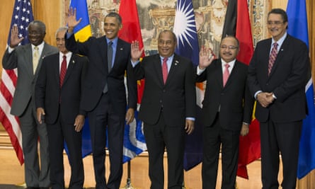 President Barack Obama at the Paris talks poses for a photo with heads of state from some of the small island nations most at risk from climate change.