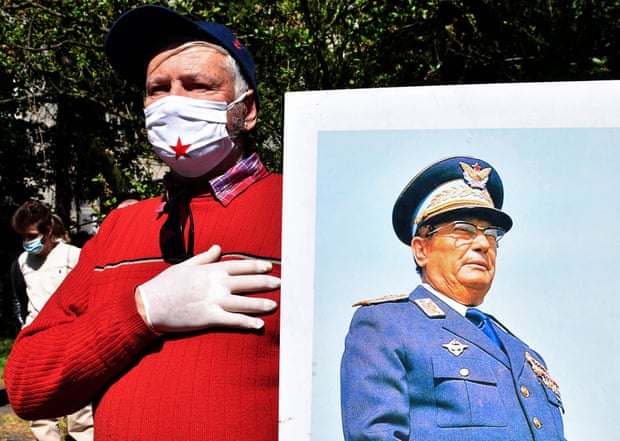 Man with portrait of Tito