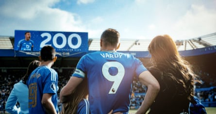 Jamie Vardy and Rebekah Vardy look at the big screen with his goal milestone on it