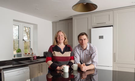 Robert and Betty Fooks in their renovated kitchen with mugs 