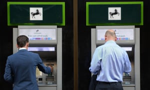 Lloyds customers withdraw money from a Cashpoint