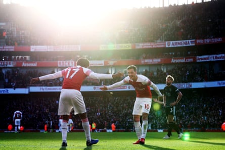December 22: Alex Iwobi of Arsenal celebrates his goal against Burnley with Mesut Ozil.