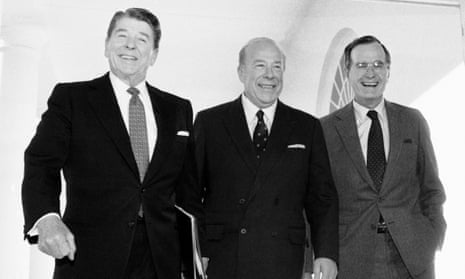 George Shultz, centre, during his time as secretary of state, at the White House in 1985 with President Ronald Reagan, left, and Vice President George Bush. They were returning after arms talks with the Soviet Union in Geneva. 