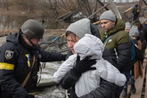 A mother and her baby seen during an evacuation in Irpin.