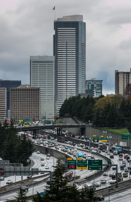 The downtown Seattle skyline shrouded in rain and clouds. About a one third of the city’s climate footprint comes from buildings, in large part from burning ‘natural’ gas for heating and cooking.