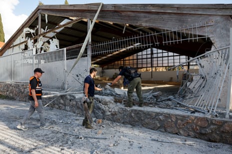 Police explosives experts work at the site near a Byzantine church, after a barrage of projectiles was launched towards Israel from Iran-backed Hezbollah in Lebanon, in Nahariya, northern Israel.