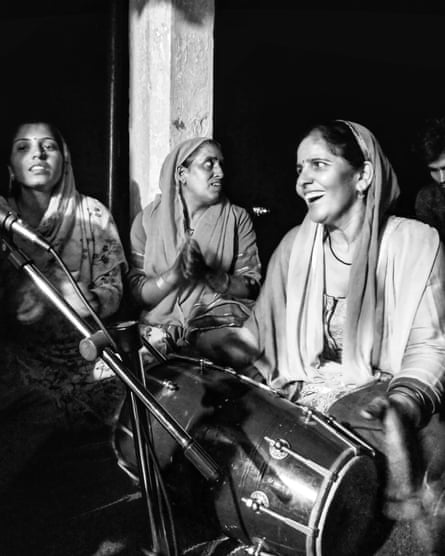 Women singing at night to celebrate Janmasthami