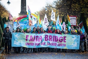 Pilgrimage groups and artists, including members of XR Faith, on the last leg of their walk to Glasgow