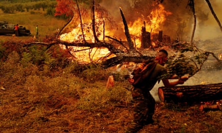 Volunteer firefighters tackle a wildfire near Kamaria in Evia, Greece, in August.