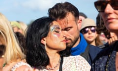 A couple embrace during the seven-minute silence held by performance artist Marina Abramovich at Pyramid stage.