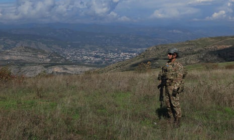 An Azeri serviceman stands at a former Armenian separatists military position in the village of Mukhtar (Muxtar) retaken recently by Azeri troops, during an Azeri government-organised media trip in Azerbaijan’s controlled region of Nagorno-Karabakh on Tuesday.