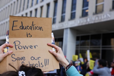 Demonstrators gather outside of the offices of the U.S. Department of Education in Washington, D.C. on March 13, 2025 to protest against mass layoffs and budget cuts at the agency, initiated by the Trump administration and DOGE.