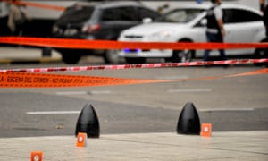 Evidence tent markers mark the crime scene where Héctor Olivares and a provincial official were shot