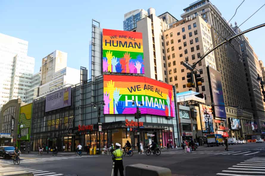 “We are all humans” billboards light up in New York City pride colors in June.