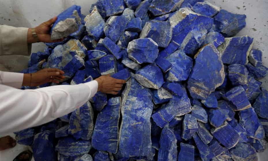 Men sort lapis lazuli inside a shop in Kabul, Afghanistan
