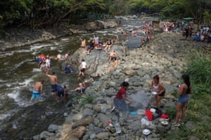 People cook sancochos, tamales and barbecues as they enjoy the traditional new year’s pot trip at the Pance river in Cali, Colombia on New Year’s Day