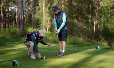 Paul O’Rahilly, a blind golfer from Gowran Park in Ireland, is lined up on the 15th tee by his guide and caddy John Kennedy